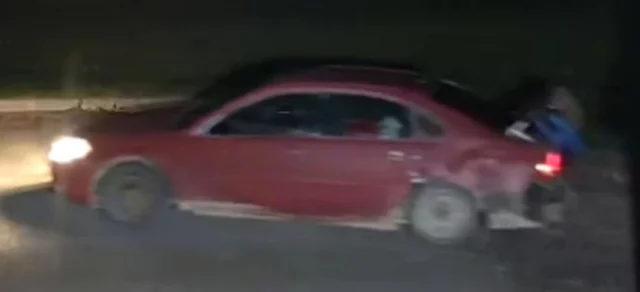 Surveillance photos show a red car, possibly a 2010 to 2012 Chevrolet Malibu. (Photo courtesy of the RCMP)