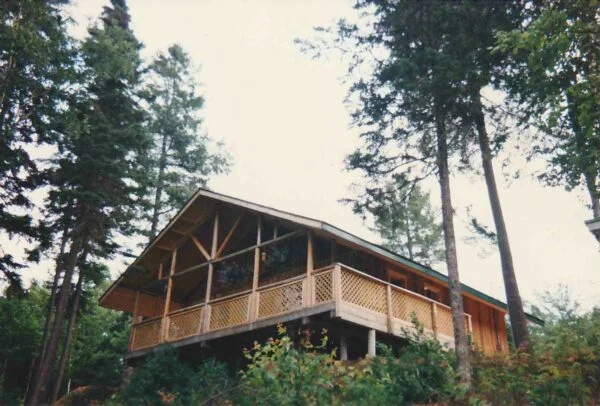 Wood frame building at camp in woods