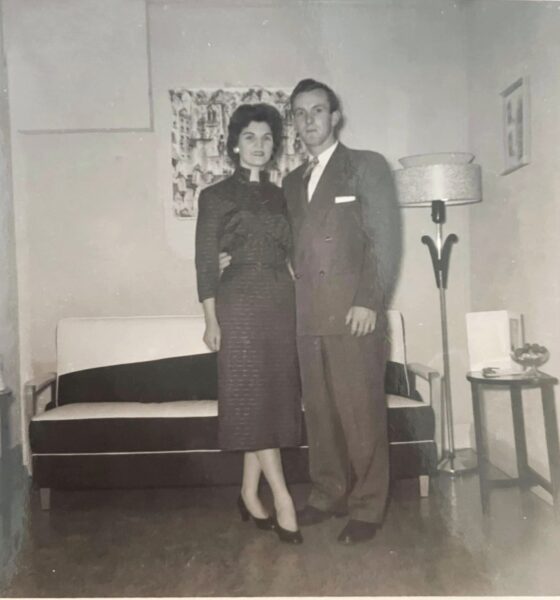 Old black and white photo of a man and woman standing together
