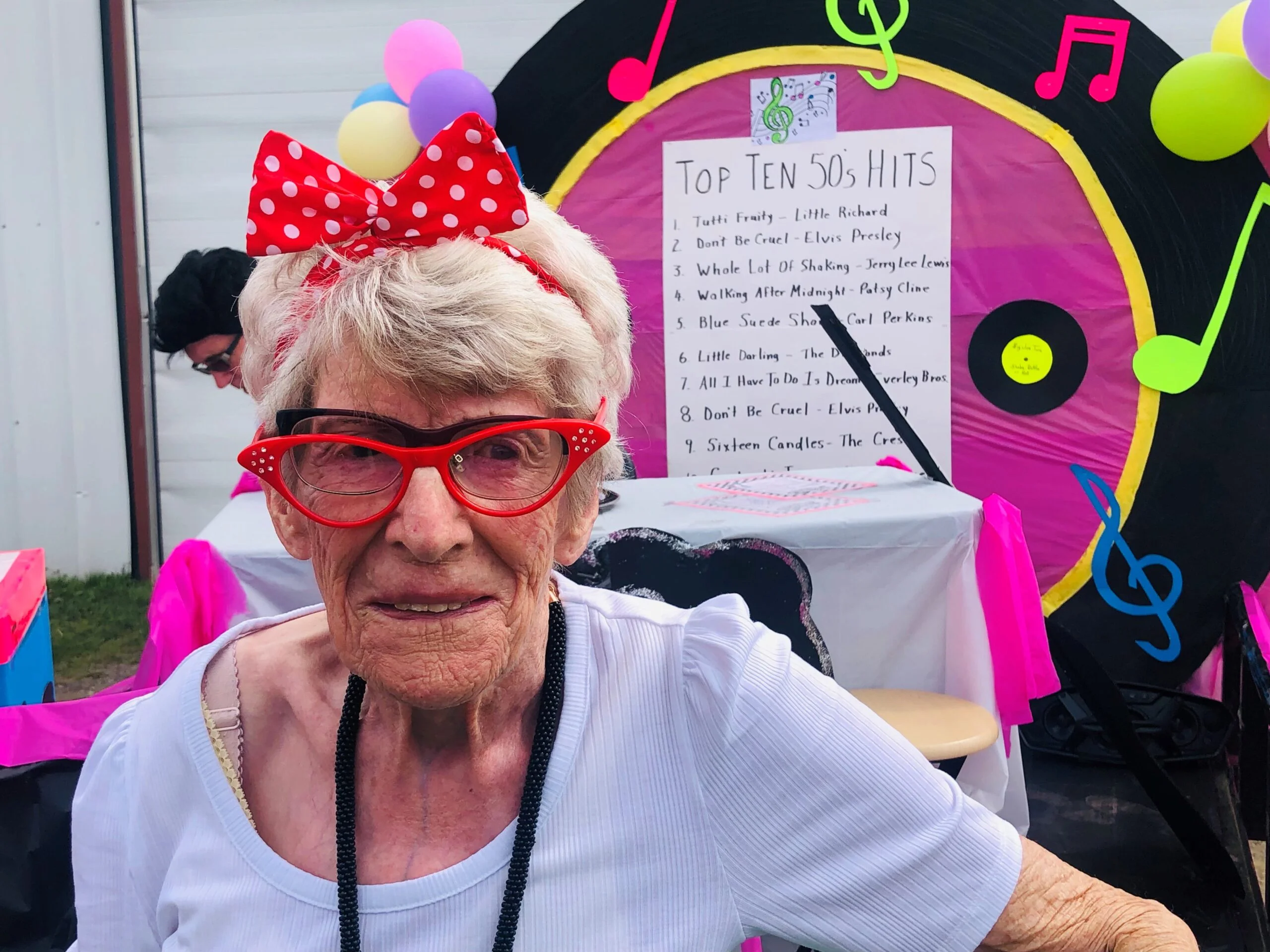 Lois Gould awaits the start of the parade on her family float featuring her extended family. Gould’s Fosterville property has long been the starting point for the annual North Lake Homecoming Day parade. (Jim Dumville photo)