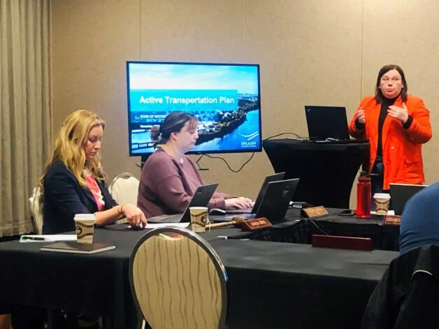 Woodstock Mayor Trina Jones, left, and town clerk Laura Gaddas, centre, look on as Jennifer Brown of Dillon Consulting delivers a presentation of the Active Transportation Plan to Woodstock council Nov. 14. (Jim Dumville photo)