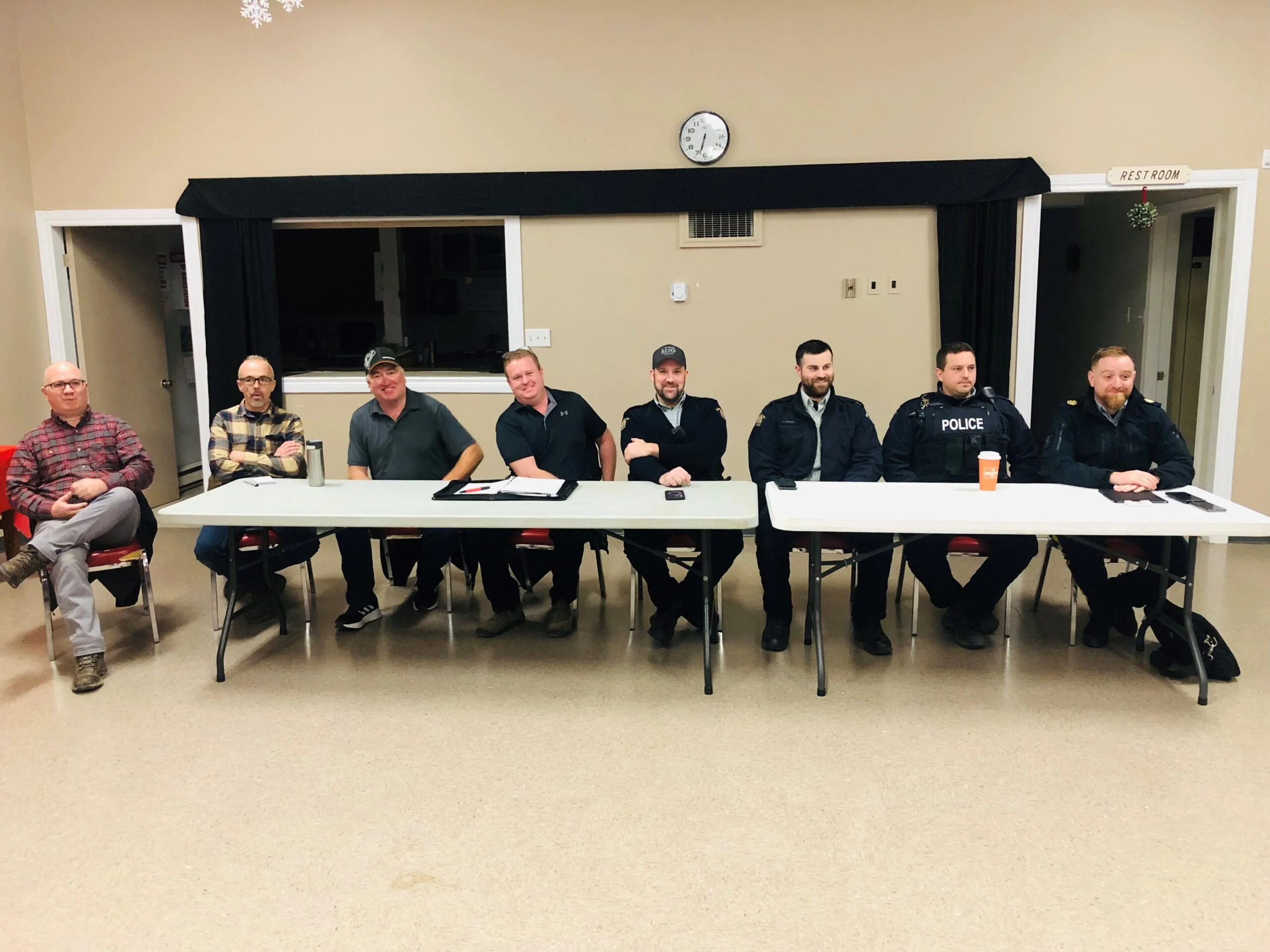 The head table at the policing open house in Richmond Corner included, from left, Woodstock Ward 2 Coun. Will Belyea, Ward 1 Coun. Mike Martin, residents Gerald Williams and Chris Foster, RCMP Cpl. James Gallant, RCMP Cst. Carson Kennedy, RCMP Cpl. Kalvin Hanscomb and Western Valley Region commanding officer Sgt. Dan Sharp. (Jim Dumville photo)
