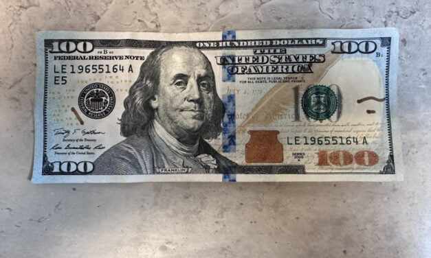 Three people charged with passing counterfeit bills