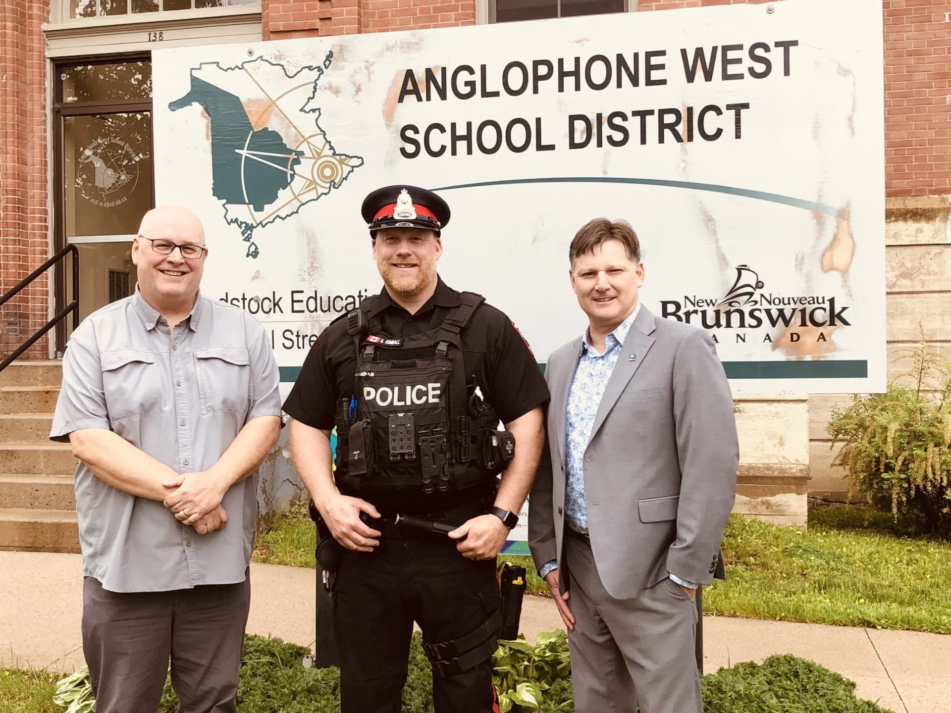 Woodstock Police Force Community Relations Officer, Cst. Shawn Kimball, centre, meets with Anglophone West School District Director of Finance and Administration Shawn Tracey, left, and Superintendent David McTimoney. (Jim Dumville photo)