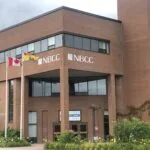 NBCC forced to cut positions, eliminate programs