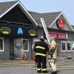 BREAKING: Fire damages Full Moon Tavern, Home Zone Electroics building in Woodstock