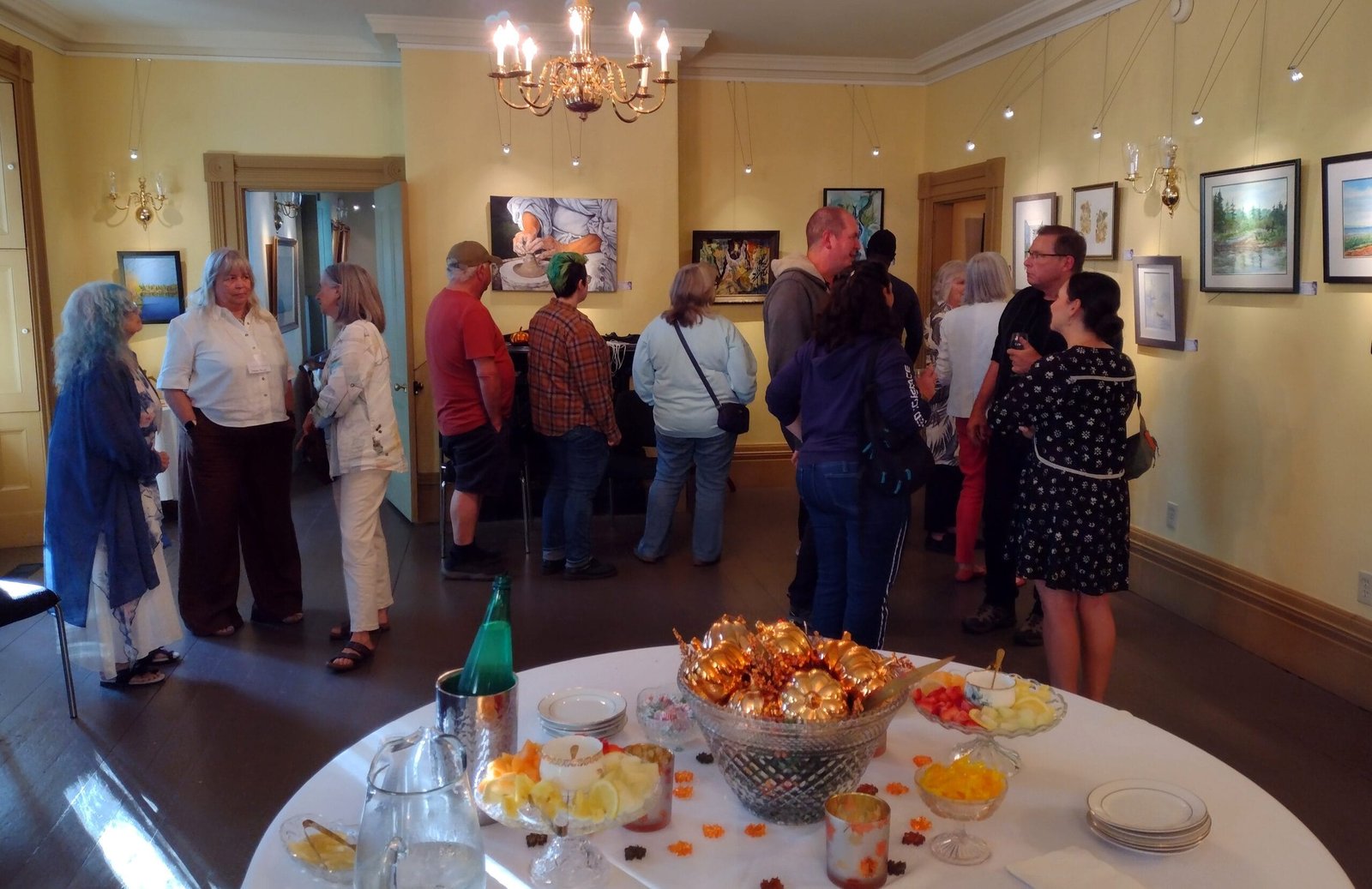 Artists and art lovers attended a show opening marking Woodstock Art Club’s 70th anniversary on Sept. 11 at Connell House. (B Rivers photo)