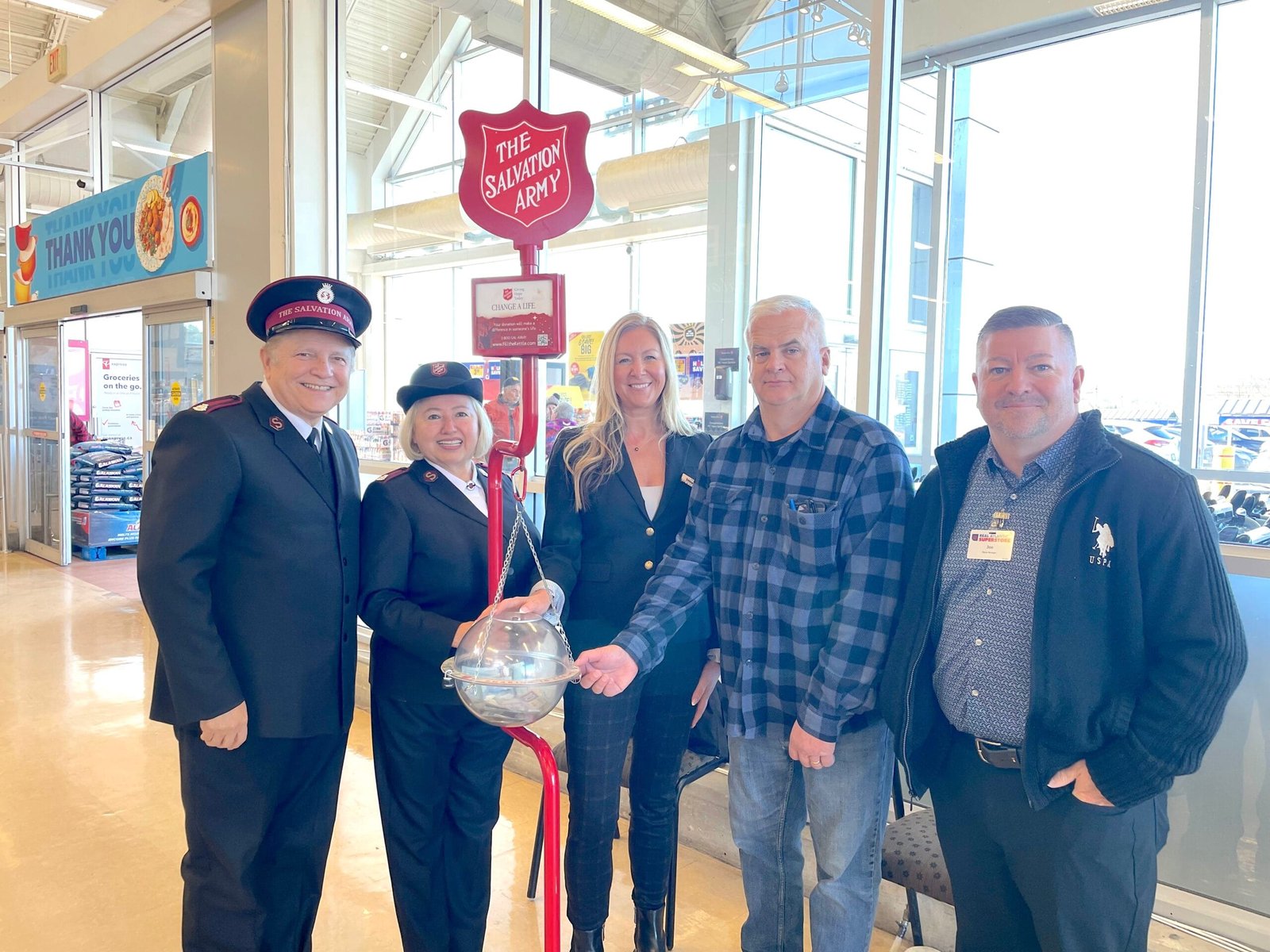 The Salvation Army’s 2025 Kettle Campaign kicked off at the Woodstock Atlantic Superstore on Thursday, Nov. 20. On hand for the launch were, from left, Salvation Army Majors Angel and Marlene Sandoval, Woodstock Mayor Trina Jones, Woodstock Town Councillor Jeff Bradbury, and Atlantic Superstore manager Joe Goodine. (Theresa Blackburn photo)