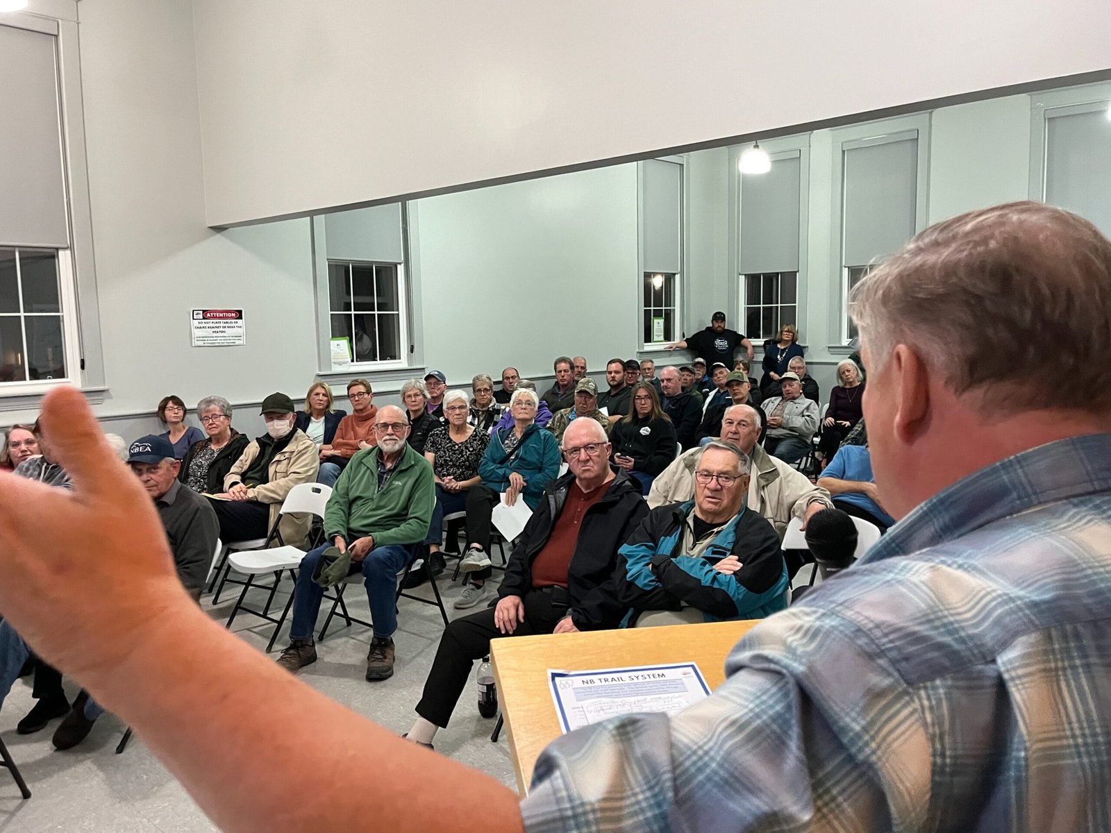 District of Carleton North Mayor Andrew Harvey addresses the public at the Oct. 23 meeting concerning ATV access on the Wolastoq Valley Trail. (Remko van Rhijin photo)