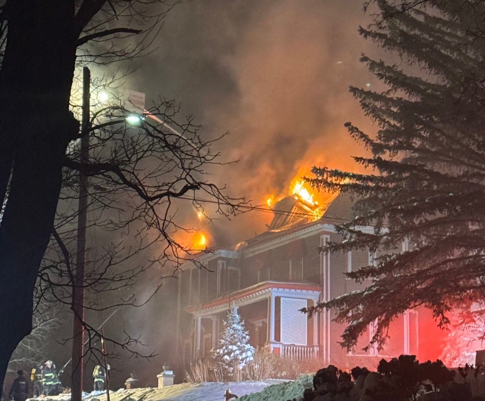 Woodstock and Hartland firefighters work through the night to contain flames at the historic Baird-Mair House in Woodstock. (James Chisholm photo)