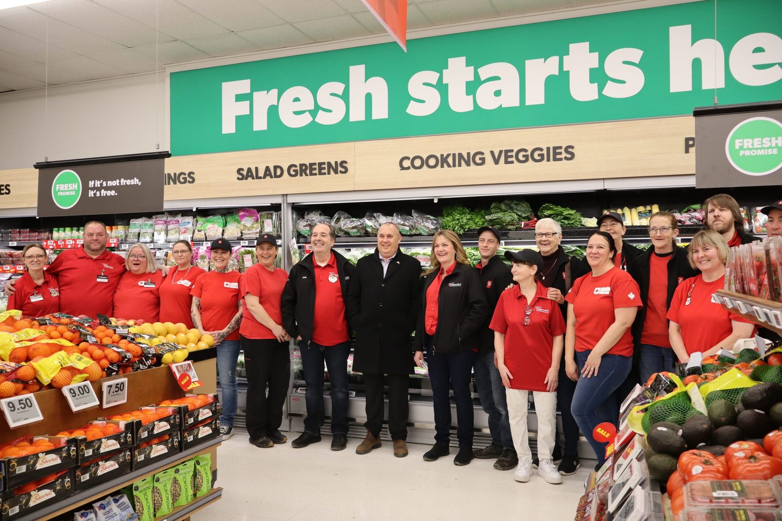 J-Lynn Jensen and John Almeida, Nackawic-Millville Mayor Tim Fox (centre), and the store’s staff at the grand re-opening on Dec. 18. (Paige Morgan photo)