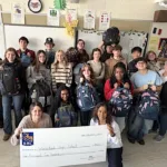 Classroom kindness: students fill backpacks to support the homeless