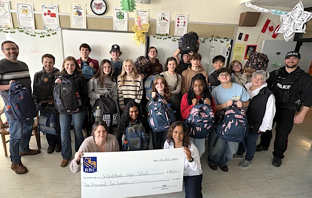 Lisa Porter’s Grade 11 English class at Woodstock High School, along with RBC volunteers, Cst. Corey Porter from Woodstock Police Force, and Valley Food Bank Director Monica Grant. (Lisa Porter photo)