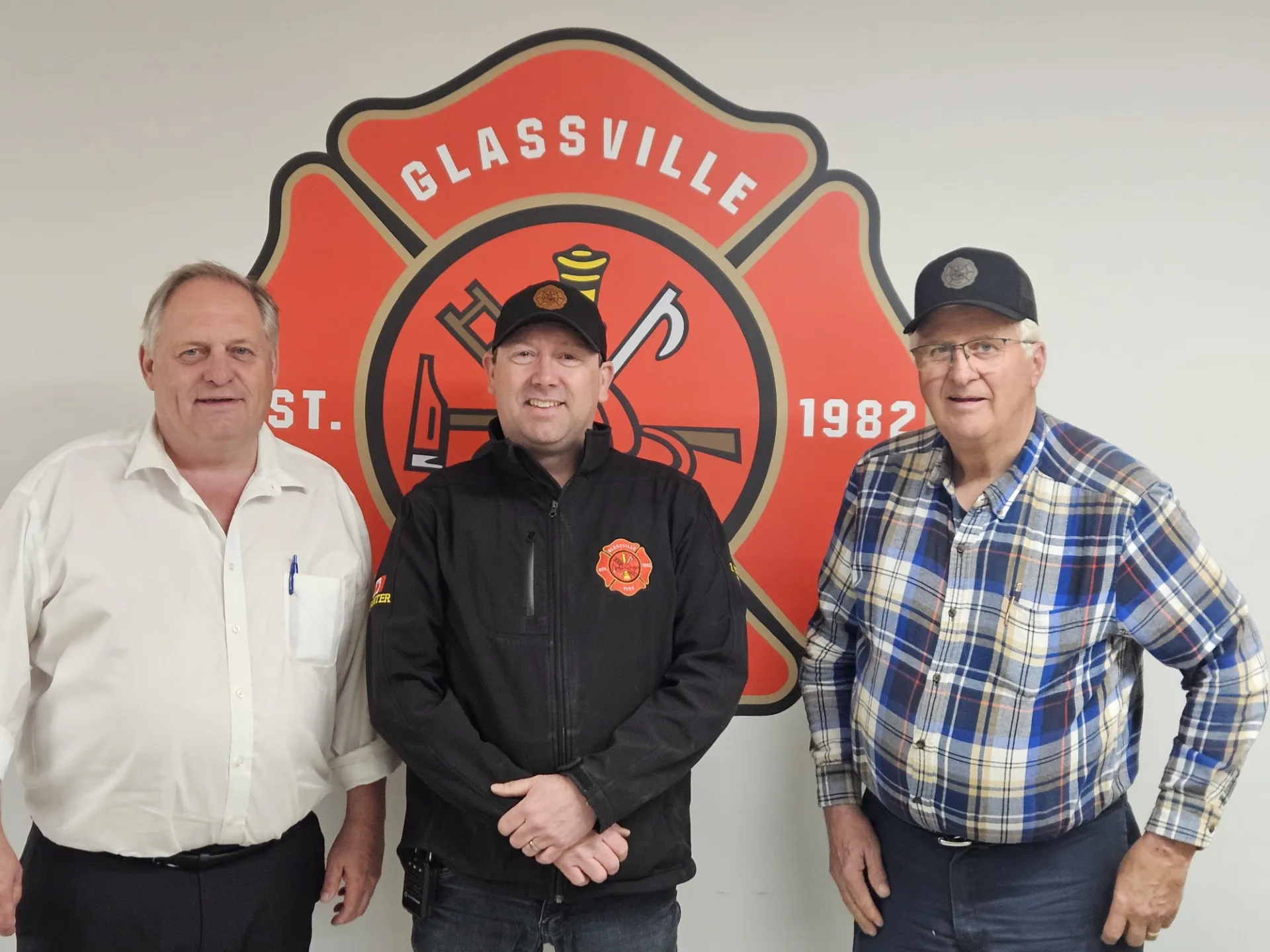 Al Downey, centre, with District of Carleton North Mayor Andrew Harvey (left) and Glassville firefighter Gailen Allen. (Connor Barry photo)