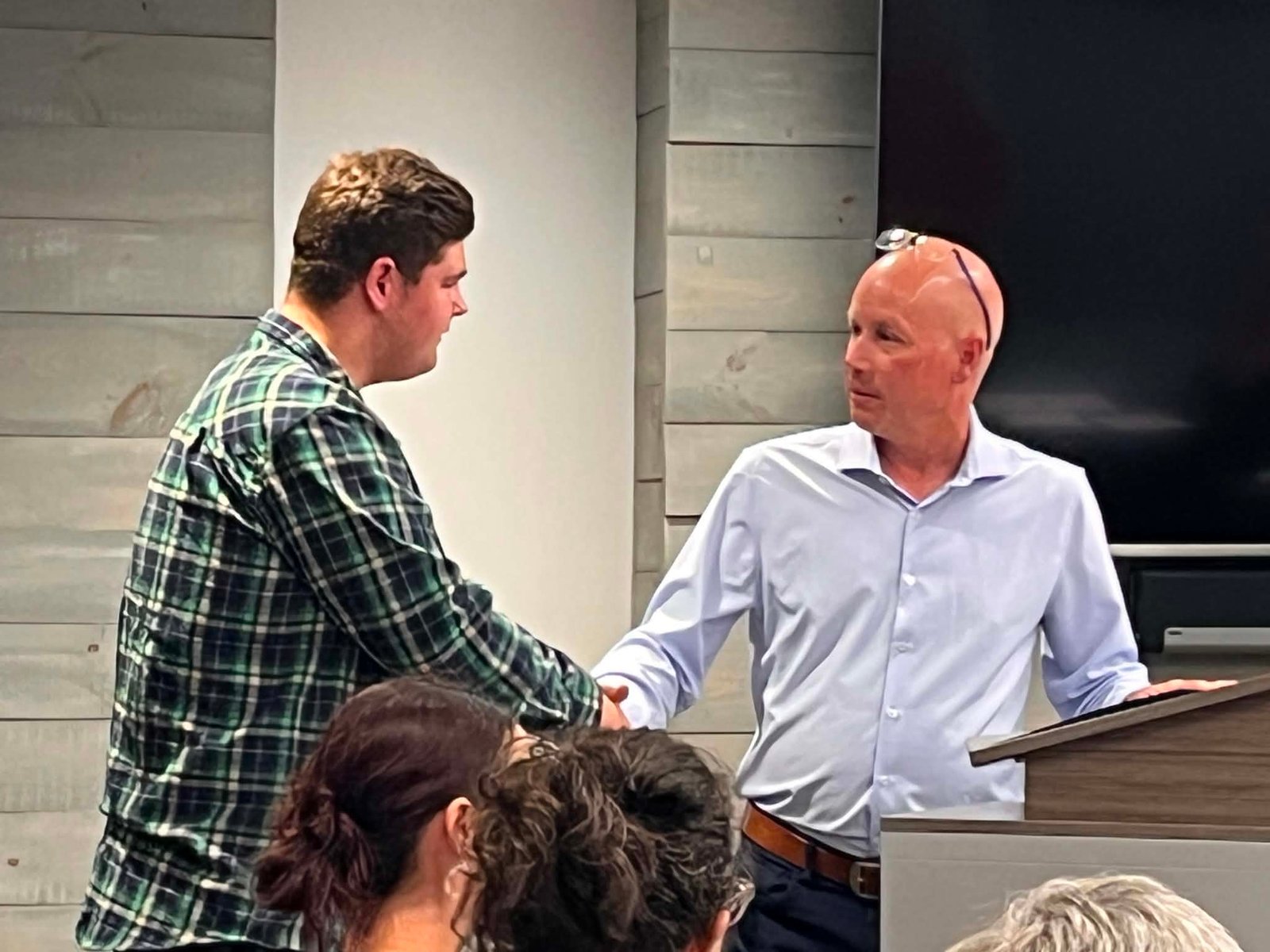 Woodstock Mayor Jeff Wright presents Jacob McDougall with the Mayor’s Commendation Award, after McDougall rescued a young girl from the Meduxnekeag River recently. (Erin Seifarth photo)