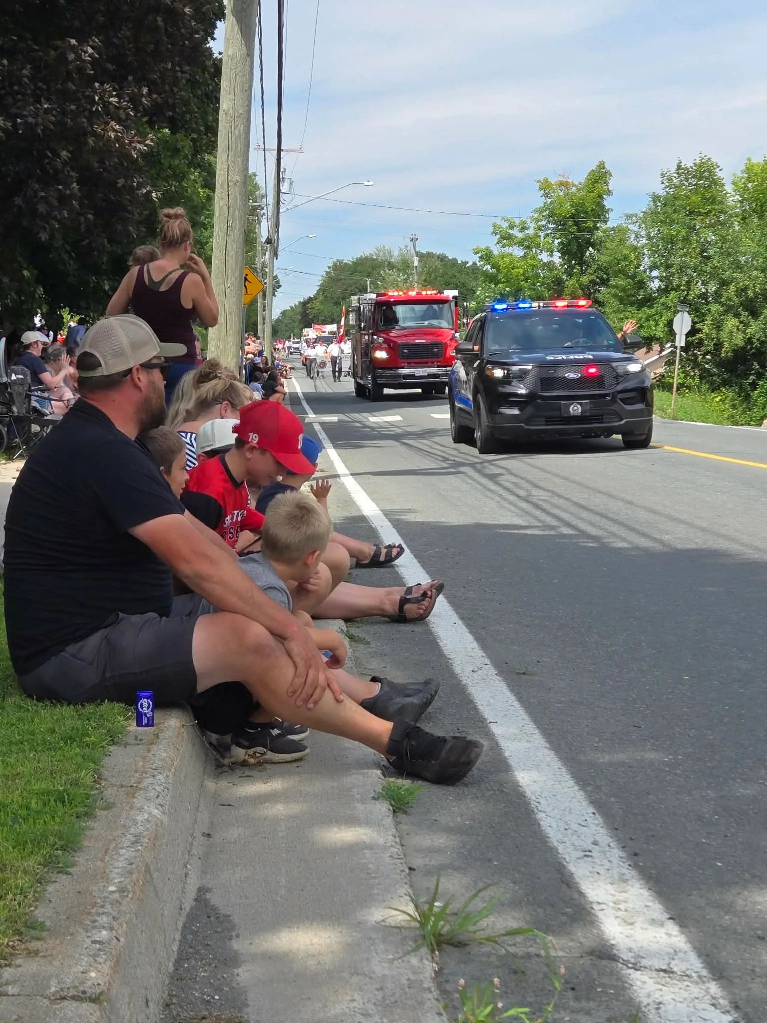 Families lined the streets on Sunday afternoon, eager to watch the annual Woodstock Old Home Week parade. (Sandra Hanson photo)