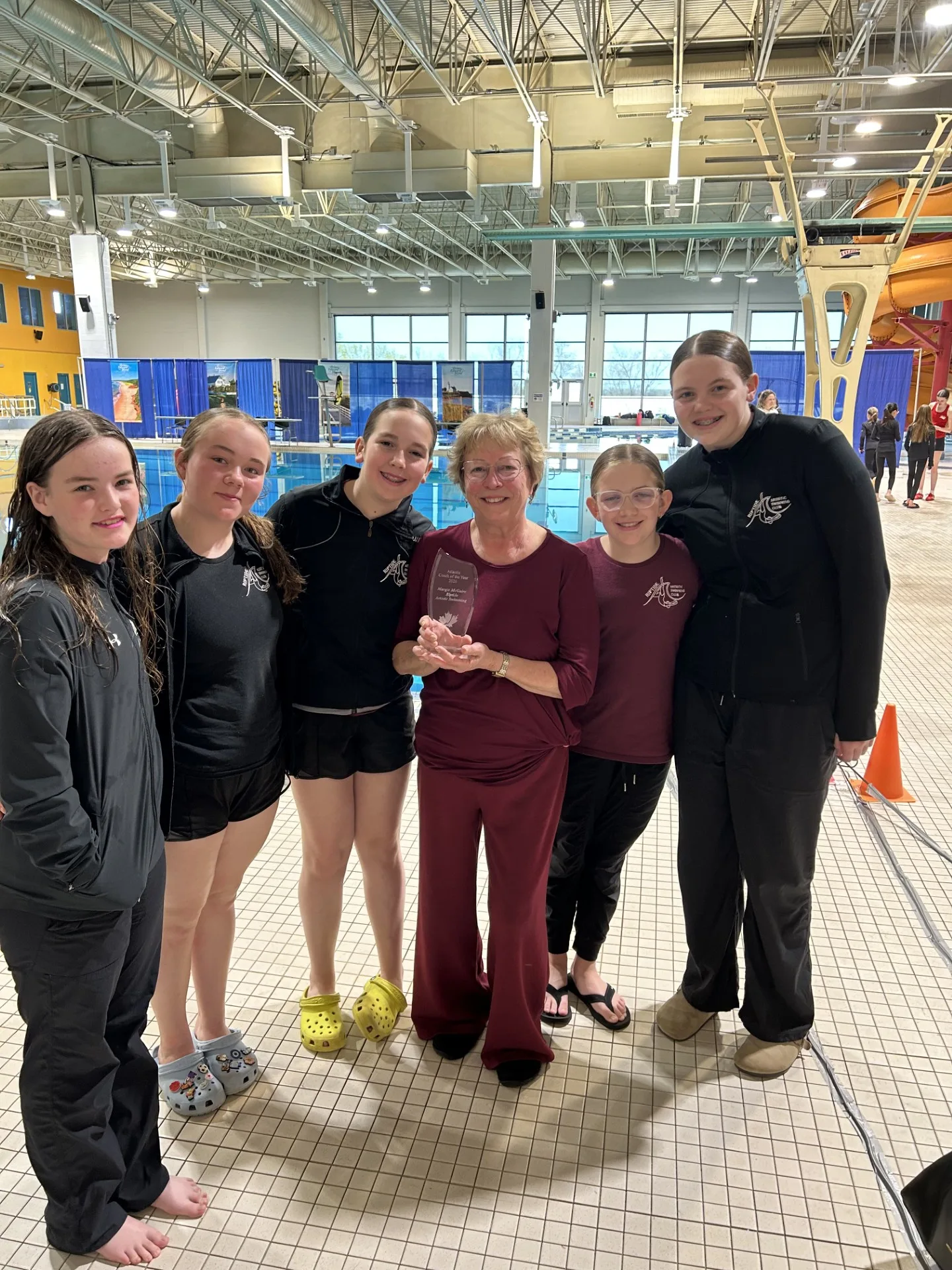 From left, swimmers Sophie Payne, Caelin Belyea, Emily Monteith, Scarlett Douglass, and Jillian Derrah were all present when coach Margie McGuire won the Atlantic Coach of the Year Award. (Photo submitted)