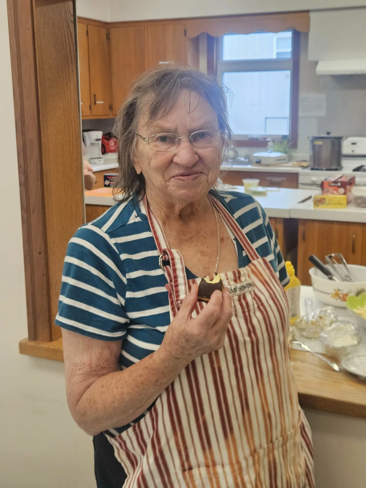 Luke’s Lunches volunteer Corinne Silverton enjoying a cookie after serving up lunches to a small crowd on Aug. 24. (Connor Barry photo)