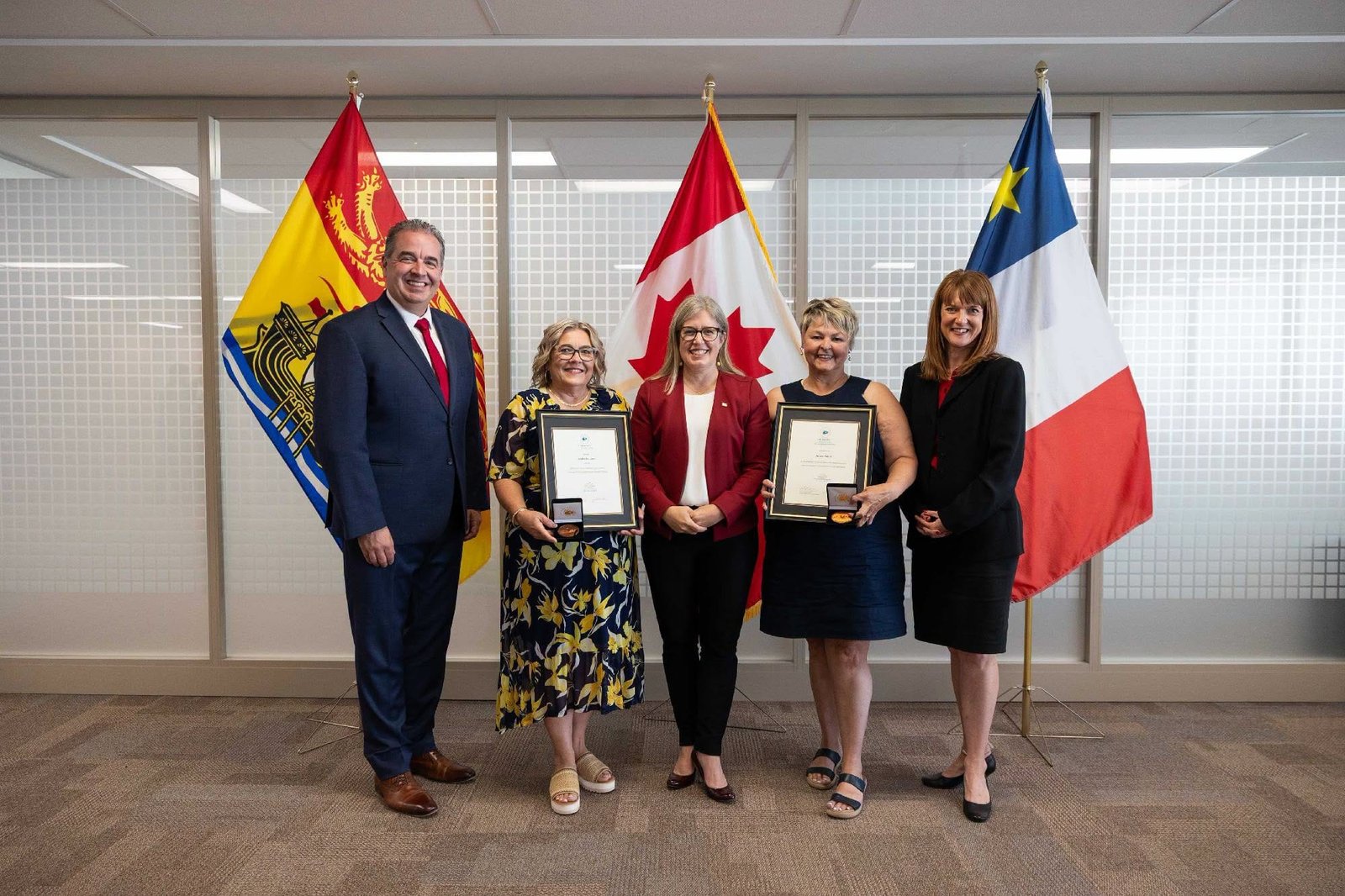From left, Hon. Jean-Claude D’Amours, Minister of Intergovernmental Affairs, Minister of Post-Secondary Education and Training, Minister responsible for Immigration, Minister responsible for Military Affairs, Lesley Anthony, Premier Susan Holt, Nicole Poirier, and Hon. Claire Johnson, Minister of Education and Early Childhood Development. (Submitted photo)