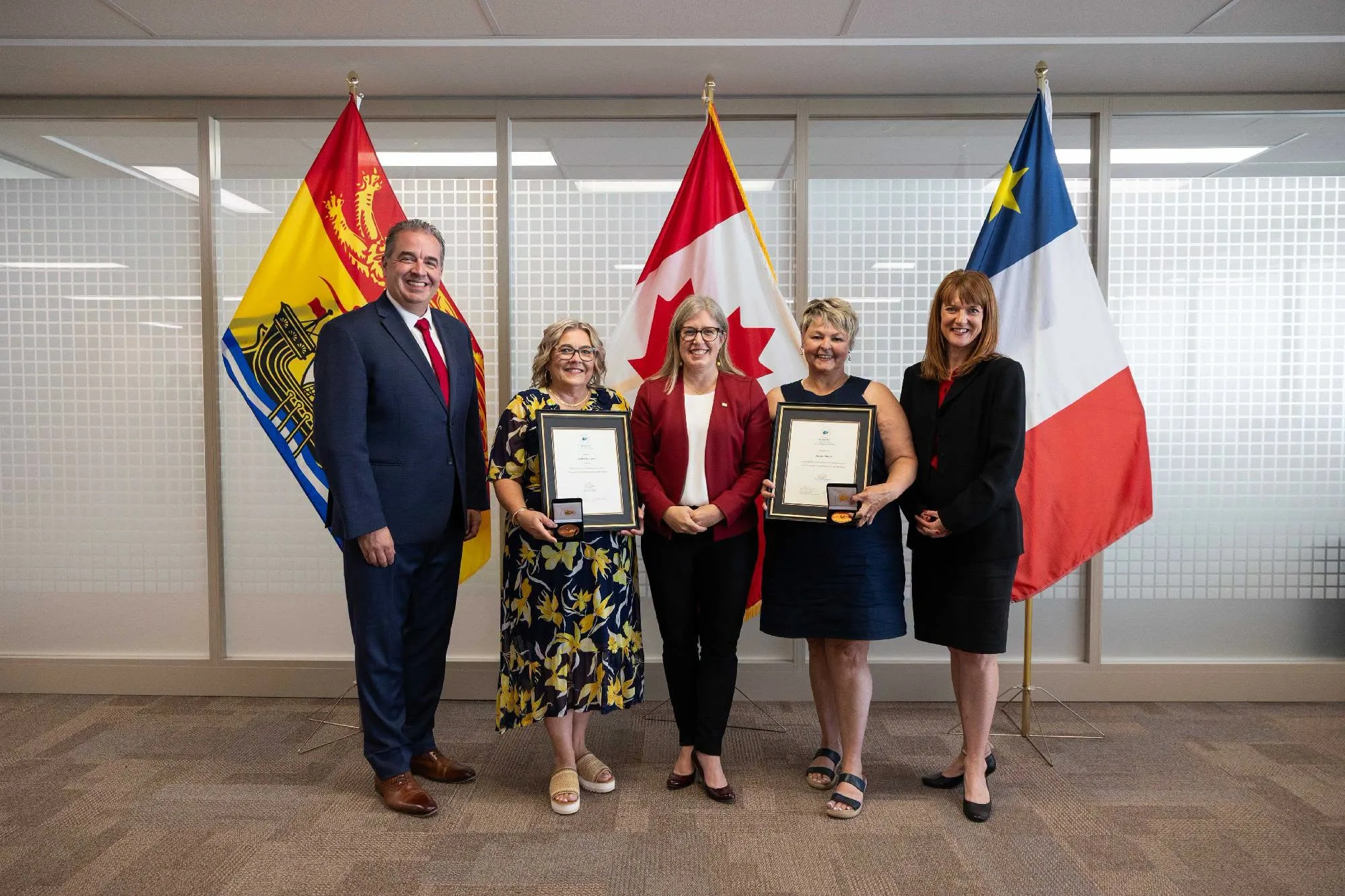 From left, Hon. Jean-Claude D’Amours, Minister of Intergovernmental Affairs, Minister of Post-Secondary Education and Training, Minister responsible for Immigration, Minister responsible for Military Affairs, Lesley Anthony, Premier Susan Holt, Nicole Poirier, and Hon. Claire Johnson, Minister of Education and Early Childhood Development. (Submitted photo)