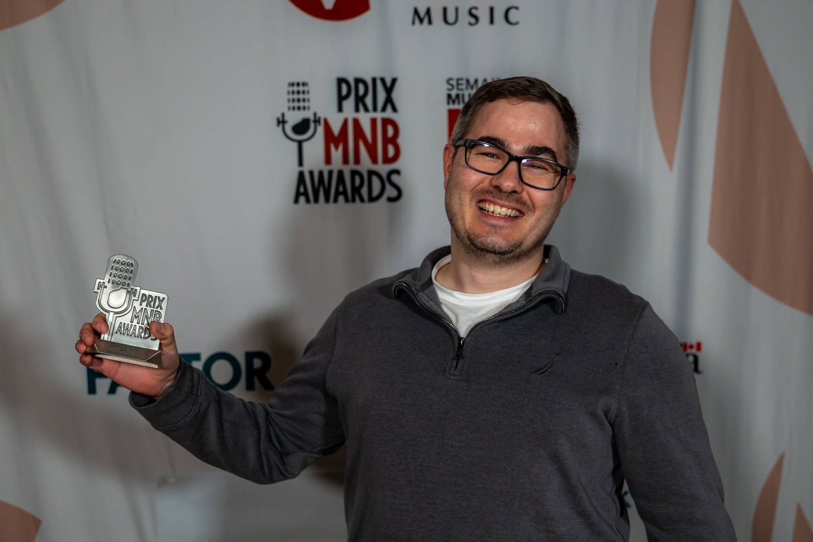Corey Crouse with his 2026 Music NB Award after winning on Oct. 22. (Scott Legge photo)