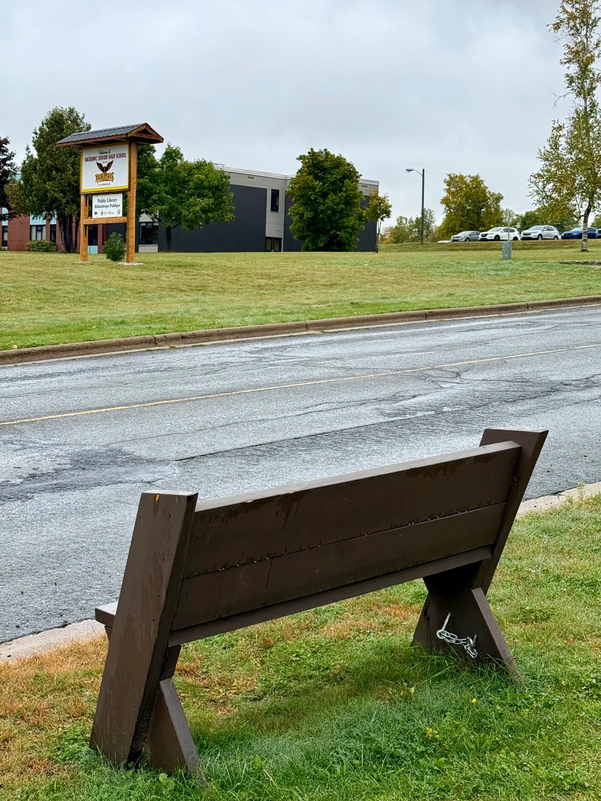 One of eight memorial benches around the Nackawic-Millville sits across from Nackawic High School, in memory of Ami Morgan’s stepson, Geoff. (Karen Howell photo)